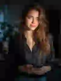 beautiful-woman-in-black-shirt Portrait of a smiling woman in black shirt posing in an indoor scene. Template for Undress AI.