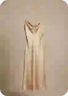 Elegant sleevelss golden satin dress with plain background. Template for clothes swap.