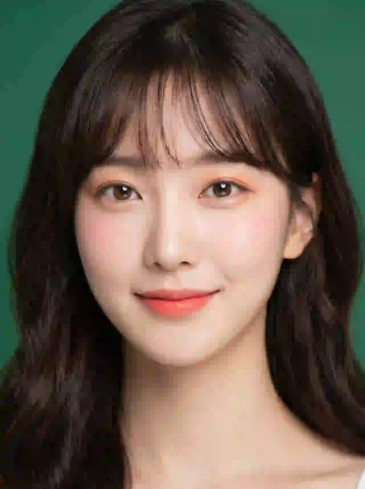 Korean woman with bangs and coral lips on green background. Template for photo face swap.